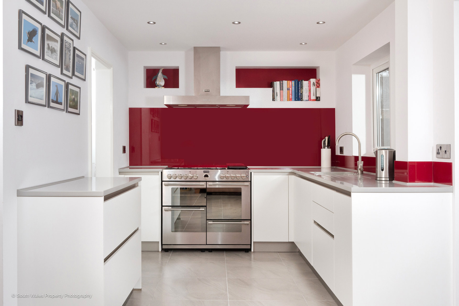 A clean white galley kitchen with German cabinetry