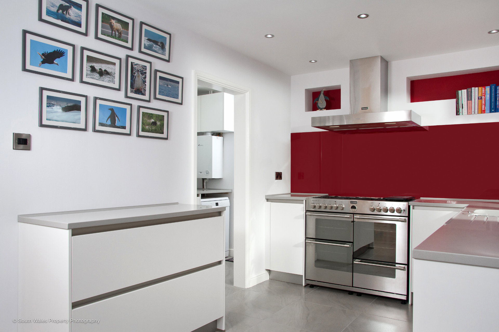 A clean white galley kitchen with German cabinetry - image 02