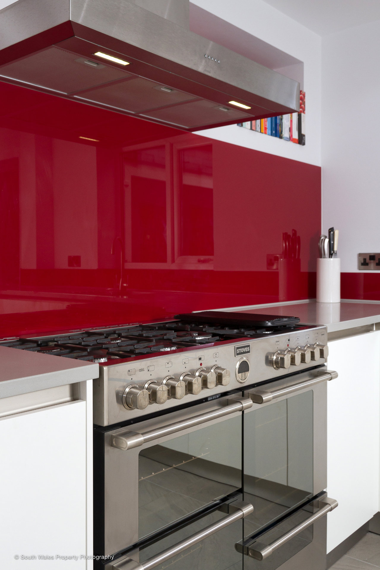 A clean white galley kitchen with German cabinetry - image 03
