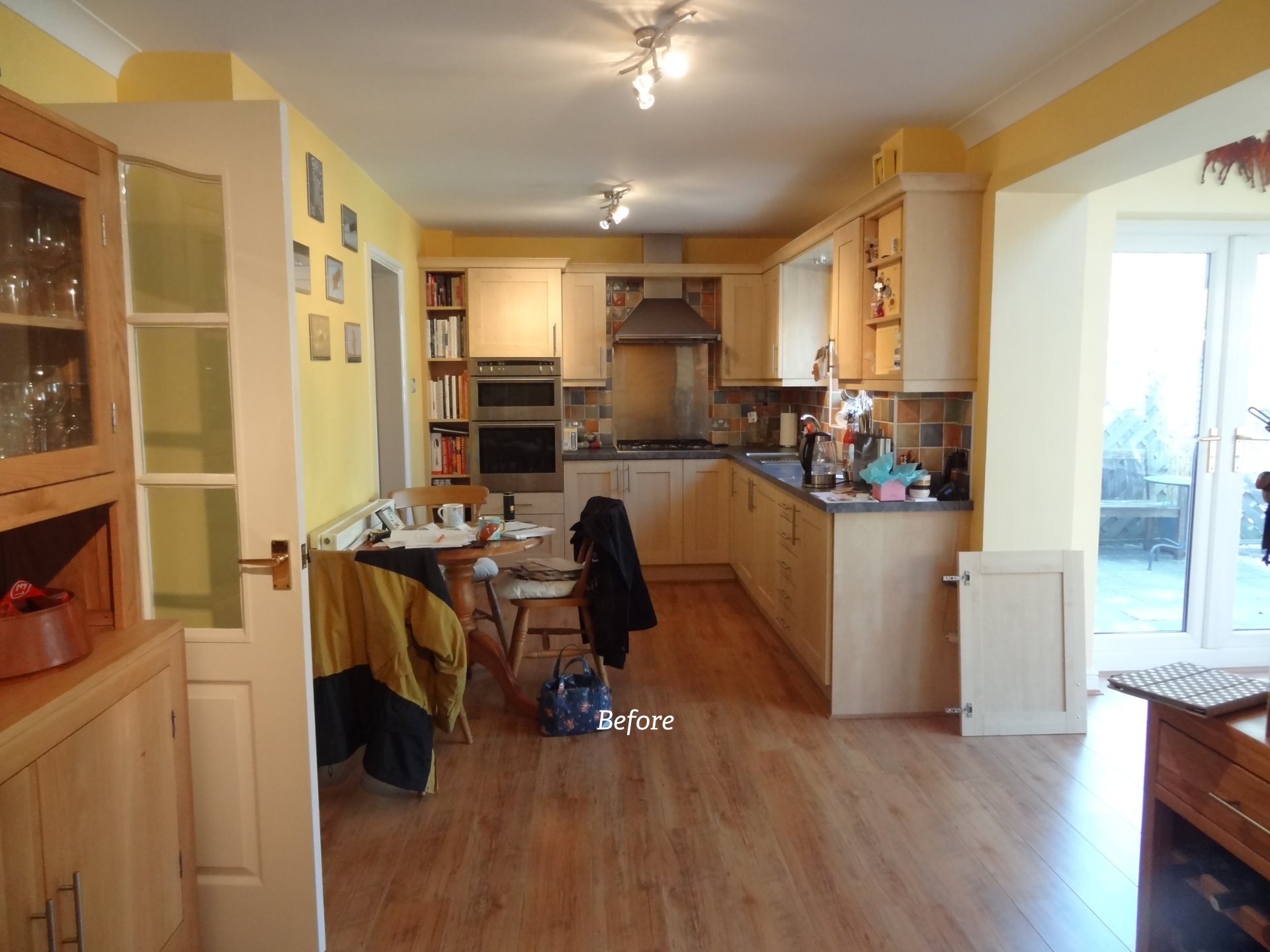 A clean white galley kitchen with German cabinetry - image 05