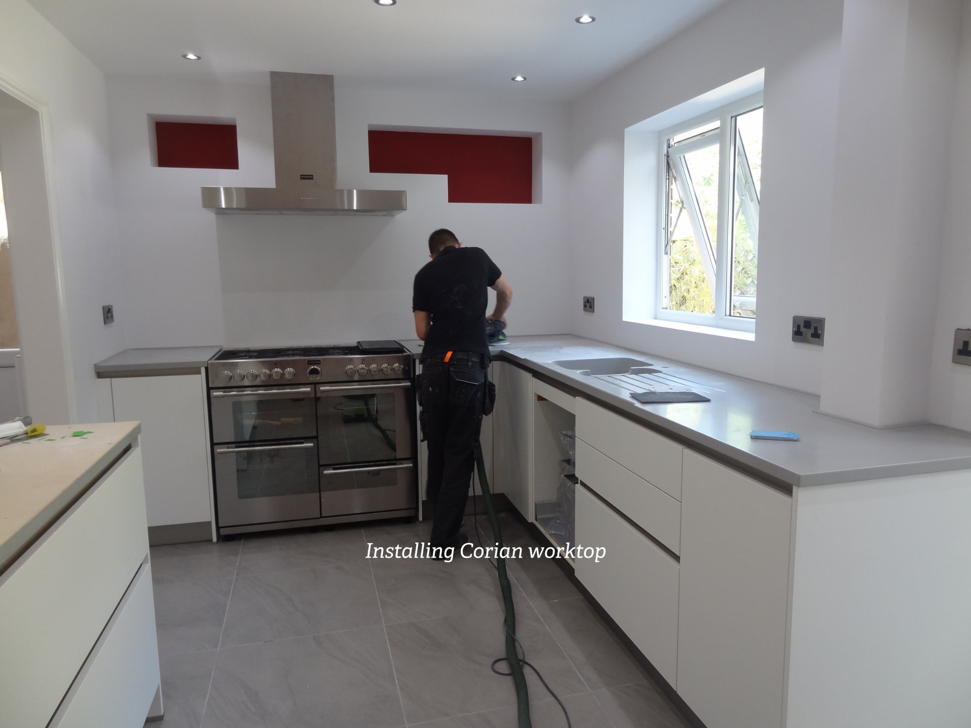A clean white galley kitchen with German cabinetry - image 05