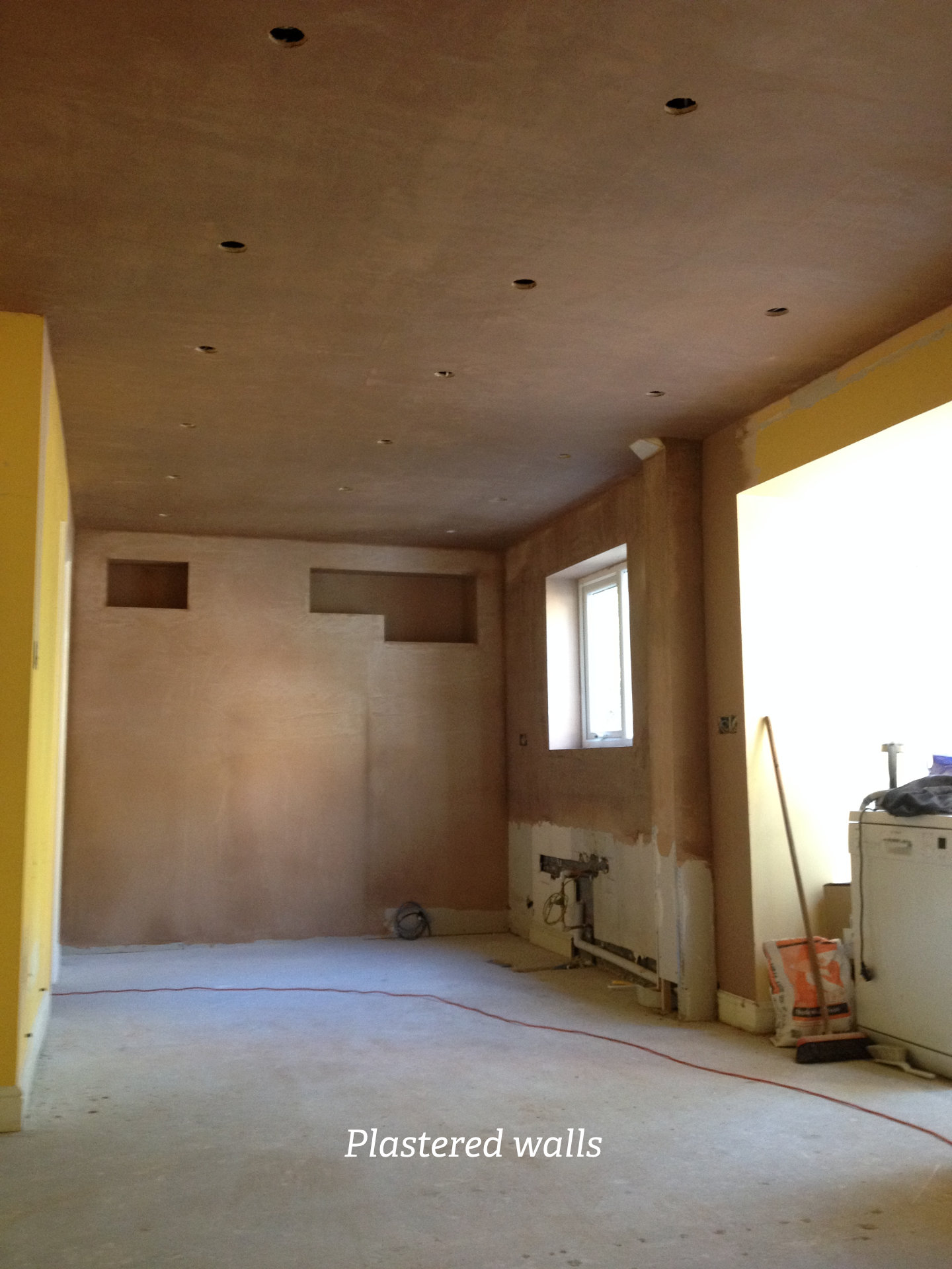 A clean white galley kitchen with German cabinetry - image 05