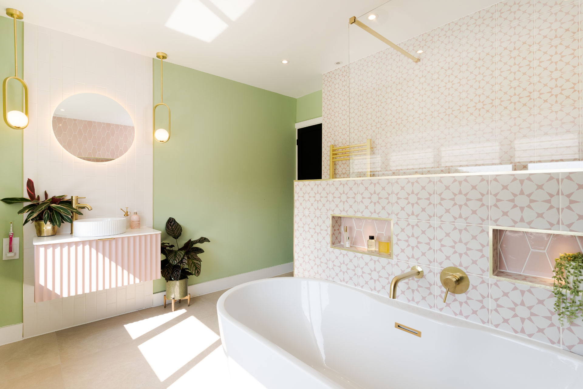 Pink and brass bathroom